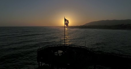 American flag close up at sunset on the Ventura Pier.  - Powered by Adobe