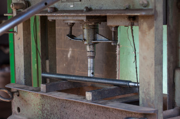Fototapeta na wymiar Finishing metal working internal steel surface on lathe grinder. Metalworking industry