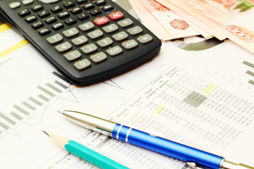 Business concept with a report and a calculator