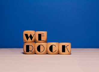 We Rock on wood cubes with blue background