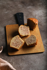 Breakfast with maffins on cutboard on light concrete background