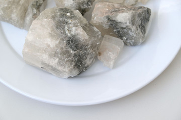 on a white background mineral source rock salt components,