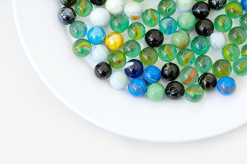 fun game for kids with colored glass marbles, glass balls,