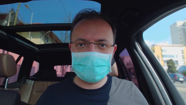 Portrait Of A Man Putting On His Medical Mask. Man Prevent Coronavirus Contamination Wearing Mask All Time.
