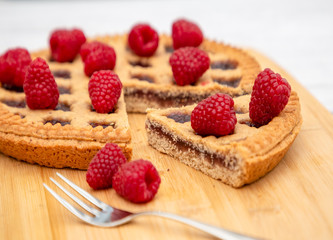 Dessert Raspberry Pie cake with strawberry or Fruit in a round bread for Break time or a party shot...