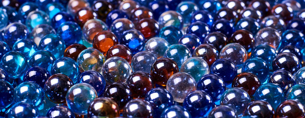 A lot of multi-colored glass balls. Can be used as background.