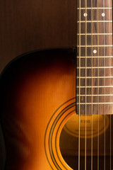 Obraz premium Sound hole of an acoustic guitar, neck, strings, frets, the nut.