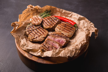grilled meat medallions grilled vegetables dark background craft bbq