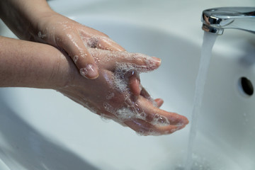 Rubbing Hands With Soap In Order To Wash Them