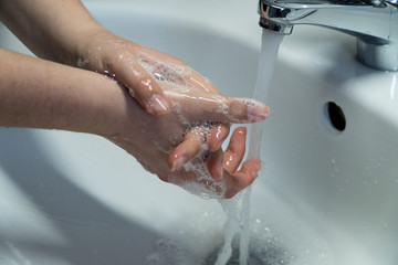 Fototapeta premium Woman's Hands Cleaned In Sink
