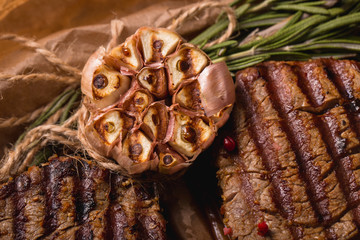 grilled meat medallions grilled vegetables dark background craft bbq