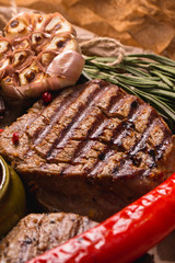 grilled meat medallions grilled vegetables dark background craft bbq