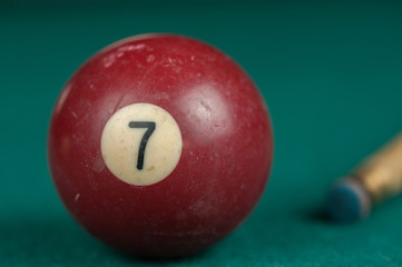 Billiards balls and cue on billiards table. Billiard sport concept.