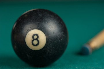 Billiards balls and cue on billiards table. Billiard sport concept.