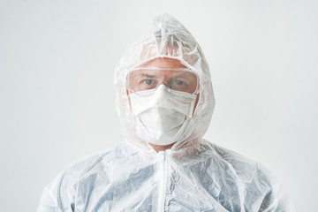 Photo of a doctor in a mask and overalls. Hand forward-stop viruses. 2019-nCoV. A man on an isolated background.