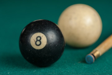 Billiards balls and cue on billiards table. Billiard sport concept.