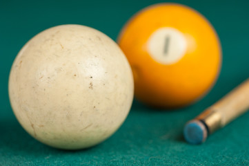 Billiards balls and cue on billiards table. Billiard sport concept.