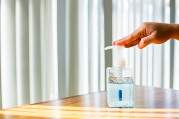 Washing hands with alcohol sanitizer to avoid contamination with Coronavirus Covid-19.