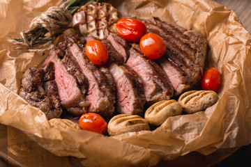 grilled meat medallions grilled vegetables dark background craft bbq