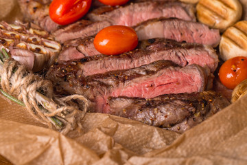 grilled meat medallions grilled vegetables dark background craft bbq