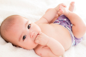 baby girl with cloth diaper