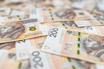 Background made from the front side of the Polish 200 PLN banknote, background for finance and economics.