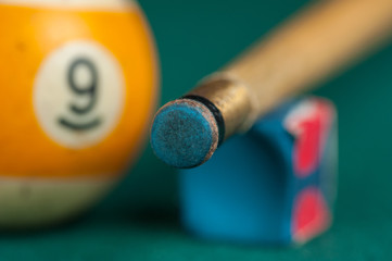 Billiards balls and cue on billiards table. Billiard sport concept.