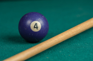 Billiards balls and cue on billiards table. Billiard sport concept.
