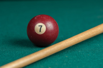 Billiards balls and cue on billiards table. Billiard sport concept.