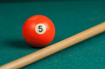 Billiards balls and cue on billiards table. Billiard sport concept.