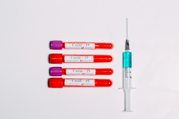 The vaccine for Coronavirus. Positive blood Tests for Coronavirus in test tubes.