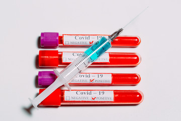 The vaccine for Coronavirus. Positive blood Tests for Coronavirus in test tubes.