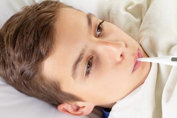 Obraz na płótnie Canvas Child flu sick, boy with medical thermometer, health little.