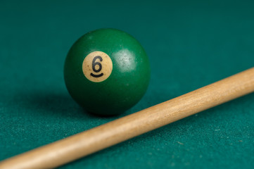 Billiards balls and cue on billiards table. Billiard sport concept.