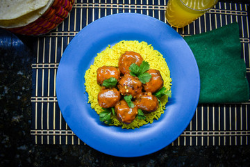 Mexican style Meatballs with chipotle salsa over yellow rice 