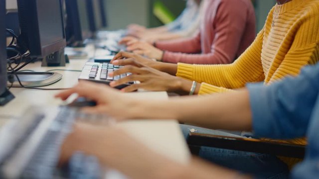 Row of Diverse Group of Multi-Ethnic People Works on PC. Office Team of Technical Support Staff Members Work on Computers, Help People Find Solutions. Anonymous Camera Shot focus On Hands
