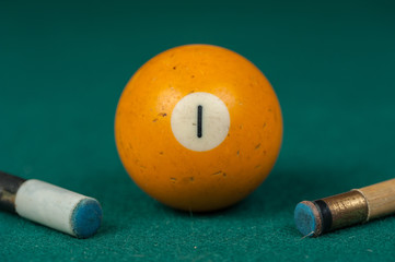 Billiards balls and cue on billiards table. Billiard sport concept.