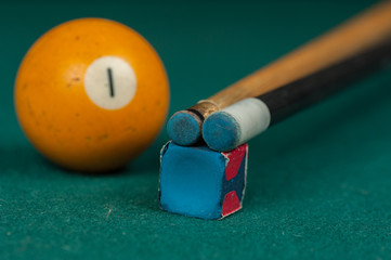 Billiards balls and cue on billiards table. Billiard sport concept.