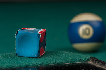 Billiards balls and cue on billiards table. Billiard sport concept.