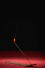 smoke of incense stick with flame