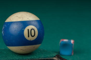 Billiards balls and cue on billiards table. Billiard sport concept.