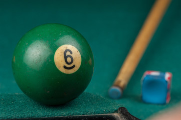 Billiards balls and cue on billiards table. Billiard sport concept.