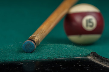 Billiards balls and cue on billiards table. Billiard sport concept.