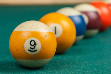 Billiards balls and cue on billiards table. Billiard sport concept.