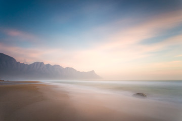 Wide angle view of a stunning sunset at Kogelbay just outside Gordonsbay in cape town south africa - obrazy, fototapety, plakaty