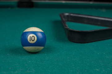 Billiards balls and cue on billiards table. Billiard sport concept.