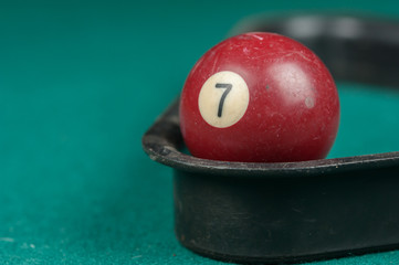 Billiards balls and cue on billiards table. Billiard sport concept.