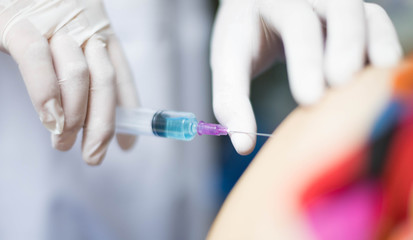 Syringe medical injection in hand holding with medicine plastic vaccination equipment with needle.