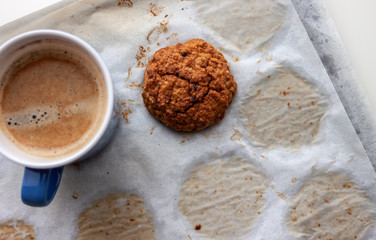 oat cookies and cup of coffee on the table