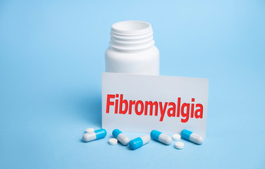 Fibromyalgia word concept on cubes, medical concept.